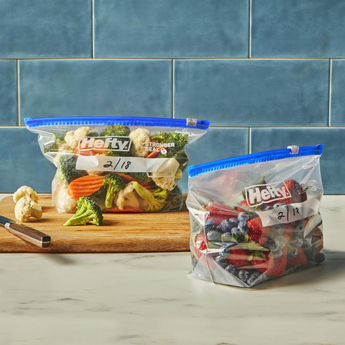 Hefty half gallon freezer slider bags filled with mixed veggies and berries