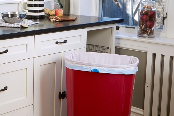 Strong Drawstring Kitchen Trash Bag in red trash can.