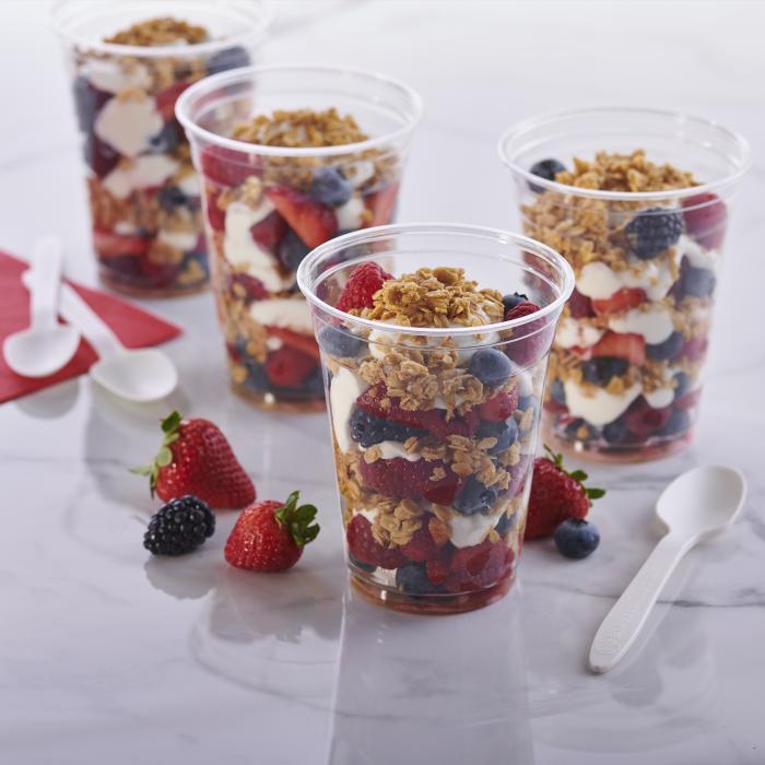 Yogurt and berry parfait in a clear plastic cup